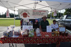 Fletch's Apple Lane was just one of the many retailers who had booths at the summer/fall farmers' market located in the parking lot of the Fortville Church of the Nazarene.