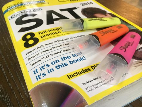 SAT Prep book 2014 with yellow, orange, and pink Sharpie highlighter