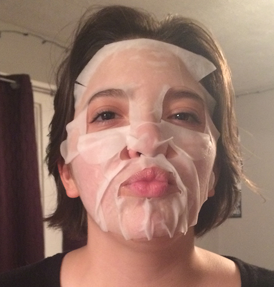 Senior Chelsea Roundtree making a face in a sheet mask