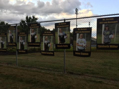 the posters of the soccer players, with Nicole Ratts in the middle