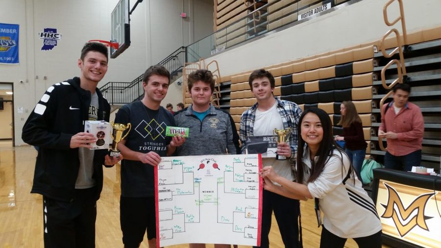 The winners and runners-up of the ping-pong tournament pose for a post-game photo.