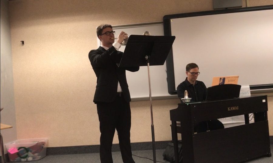 Andrew Roembke rehearses for his trumpet solo.