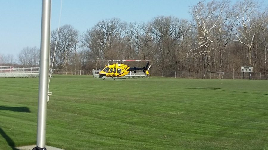 For the simulation, a helicopter prepares to take a victim to the hospital.