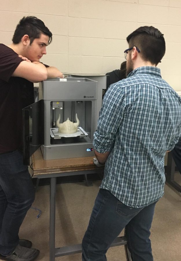 People working with the 3D printer
