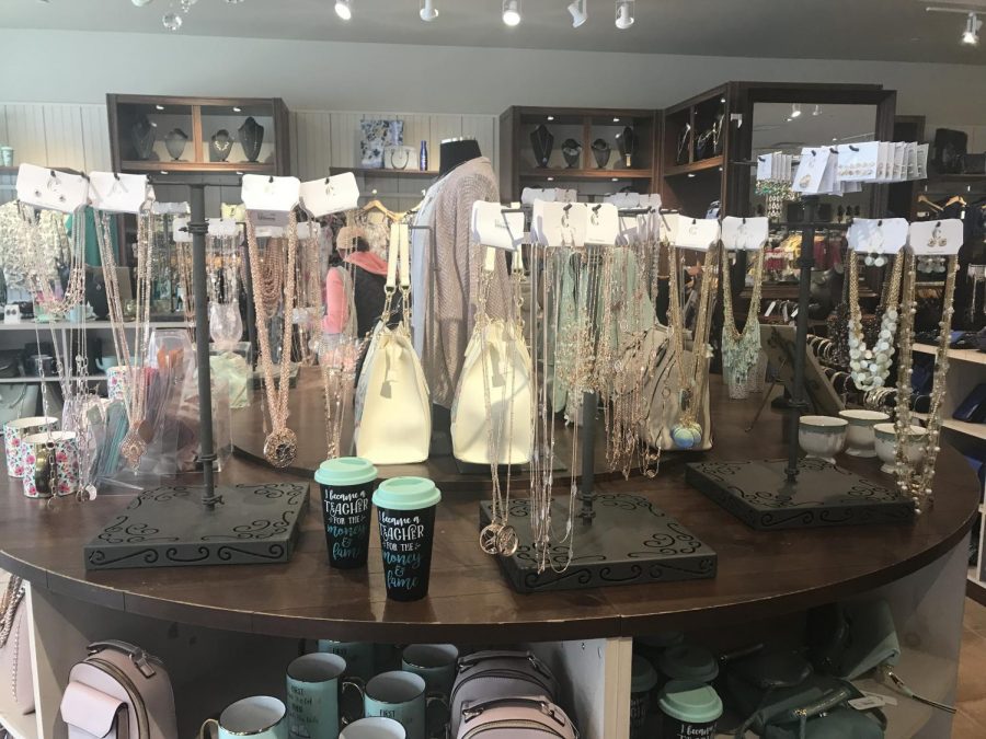 A table with several jewelry displays.