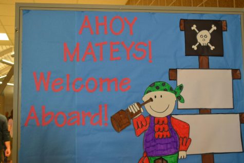 A bulletin board that reads "Ahoy Mateys! Welcome Aboard!"