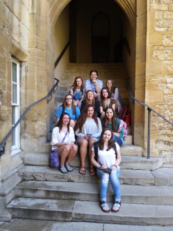 students sitting on the stairs in Oxford which were used to shoot a Harry Potter film