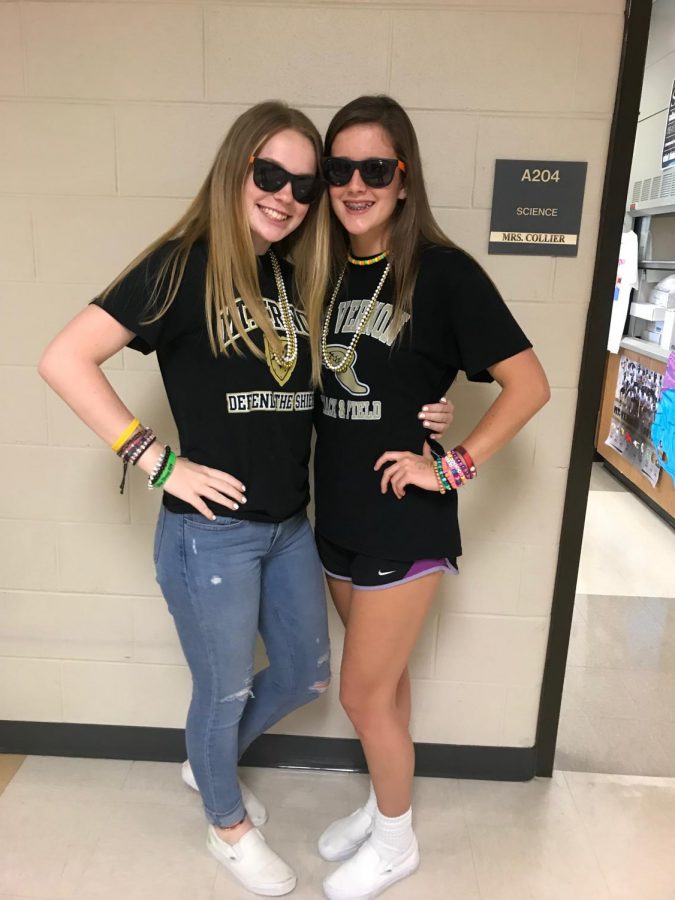 Two Students with glasses posing for Spirit Day