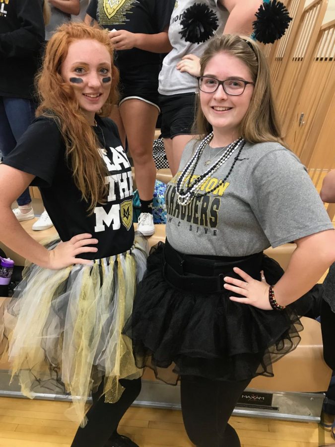Two students dressed in tutus
