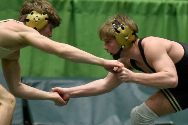 Carson Johnson hand fighting the other guy for a take down at Semi-State.