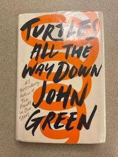 Number eight is “Turtles All The Way Down,” written by John Green. This is a character that deals with OCD and tries to solve a local mystery.

