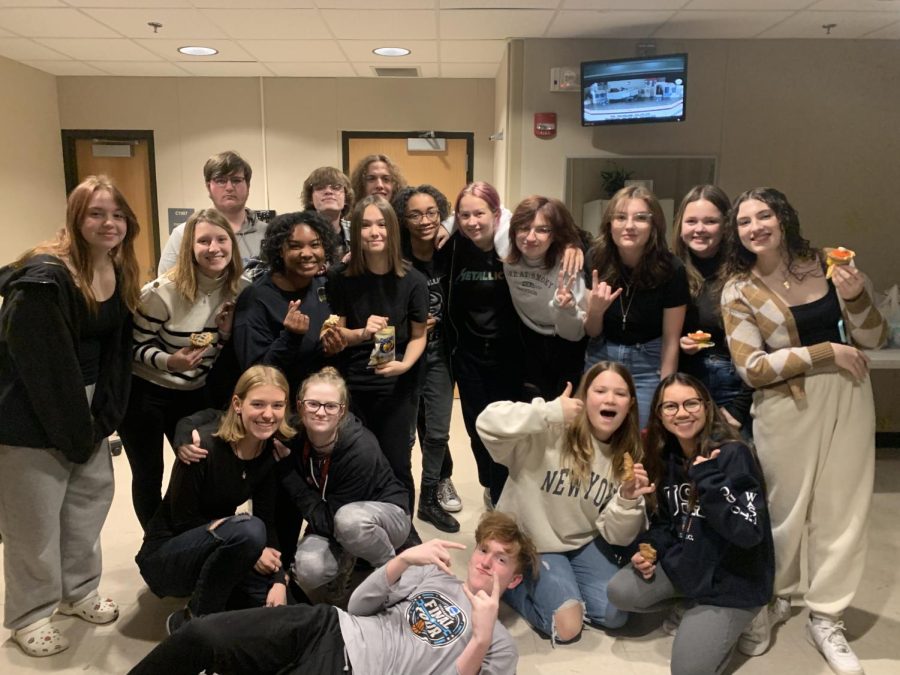 The crew and cast have fun while they work. They are all close and hang out after school as well as rehearse and create sets and props for the musicals. 

