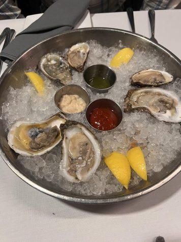 The half dozen oyster appetizer, served atop a bed of ice
