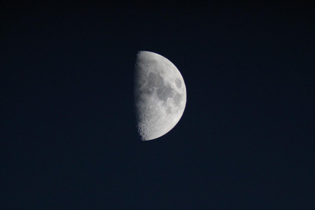 The moon is a very prominent object that is easily visible to the naked eye, but can be seen here in greater detail through a telescope.
