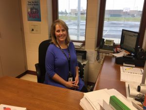 picture of Mrs. Tingwald, elementary STEM teacher, sitting at her desk. 