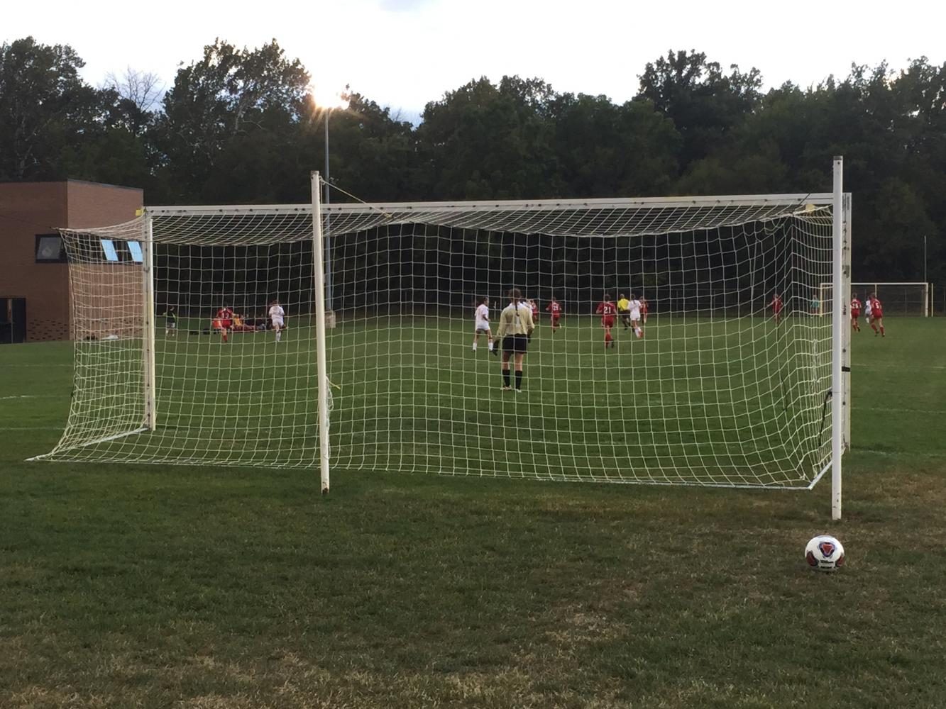 Photo of girls' soccer team practicing on the field