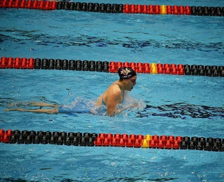 Lydia Teirney swimming during a meet