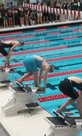 Lydia Tierney is on a starting block and is waiting for the buzzer to go off