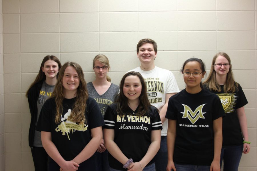 7 students stand in their MV shirts, smiling.