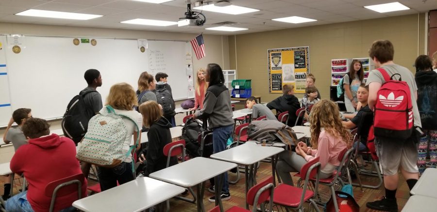 Students by desks.