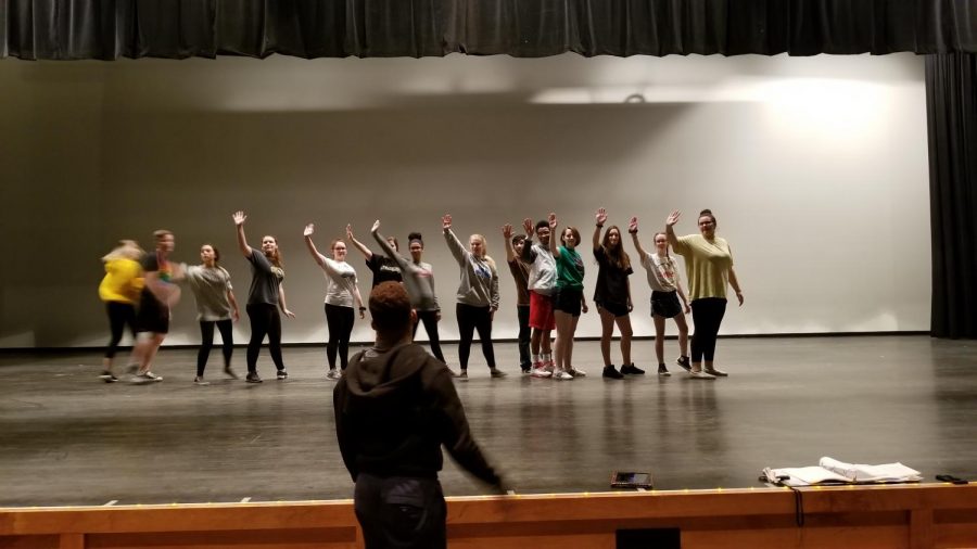 Cast dancing onstage