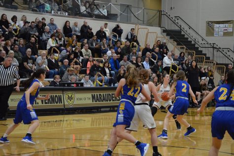 The girls are ready to pass the ball and shoot.