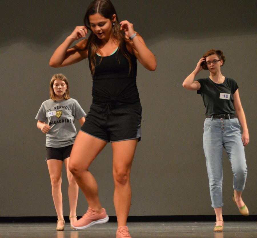 Former student Emily Thomas showing Gabby Bruce and Natalie Marshal the tap dance