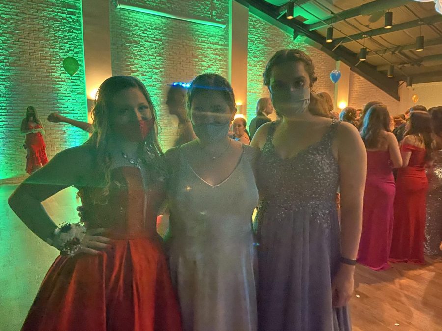  Ashley Wyman (11), Katelynn Hexamer (11), and Anna Starken (11) having fun at prom. 
