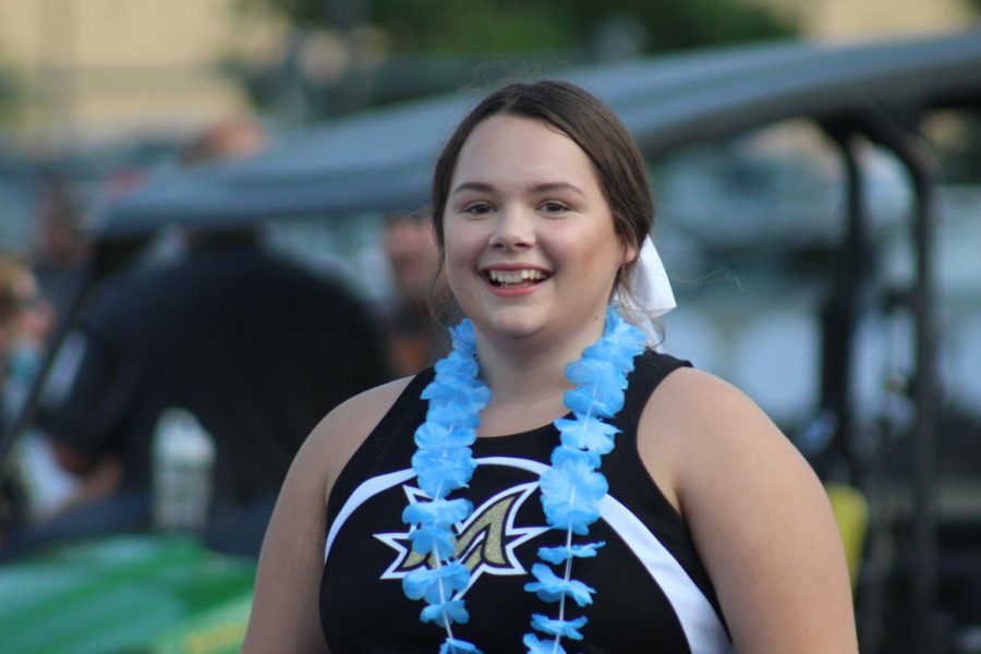 Senior Madison Foley displays extreme joy as she walks onto the field