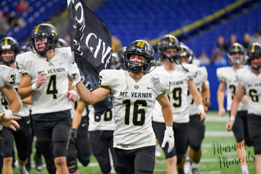 The Mt. Vernon football team running out onto the field at the beginning of the game 