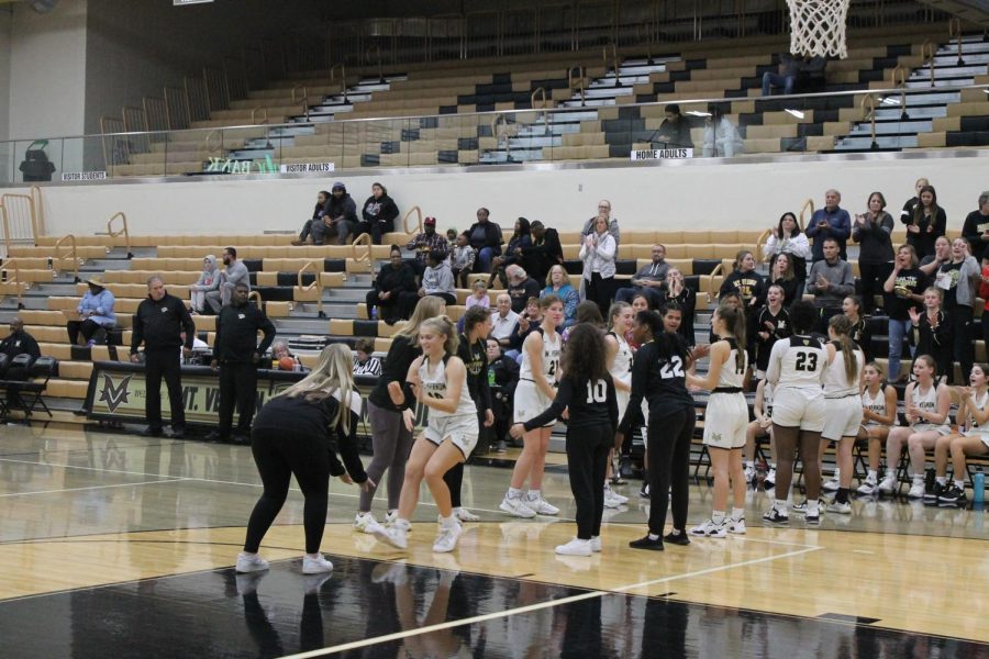 Sophomore Reagan Britt, jersey number 10, getting introduced onto the court. 
