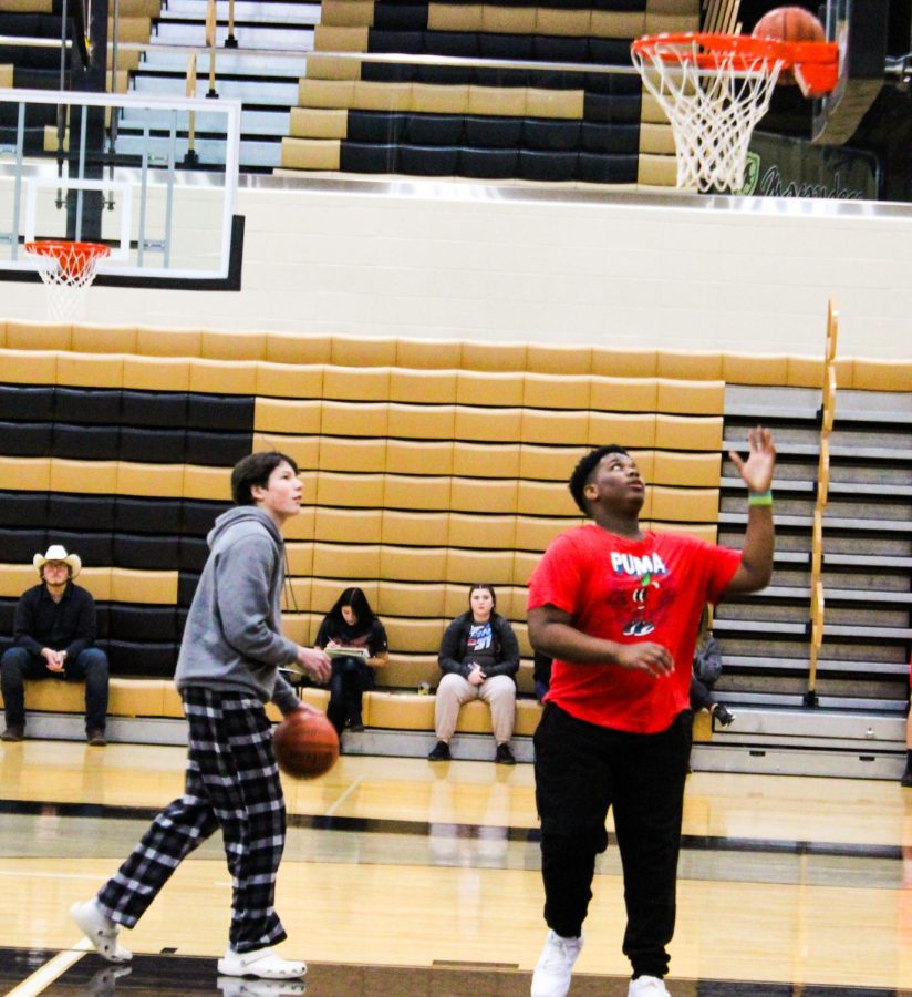 Christian Austin (Grade 11) up for his shot at knockout. Knock out is a fun basketball game where you get in a line, the first two people in line shoot the ball and whoever makes it, stays in the game. They keep going through the line until there is a winner. 
