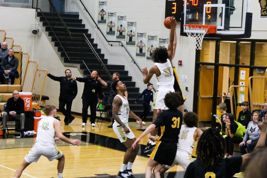 Marauder player Number 30, R´mani Wells (Grade 9), blocking a 1 point shot from Avon. 
