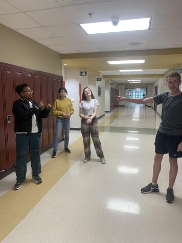 Picture of 4 students in the hallway preparing for lip dub 