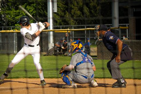 Member of the varsity baseball team up to bat 