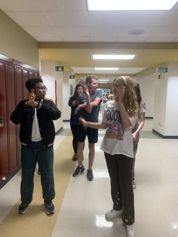 Picture of 4 students doing their dance for the lip dub. 