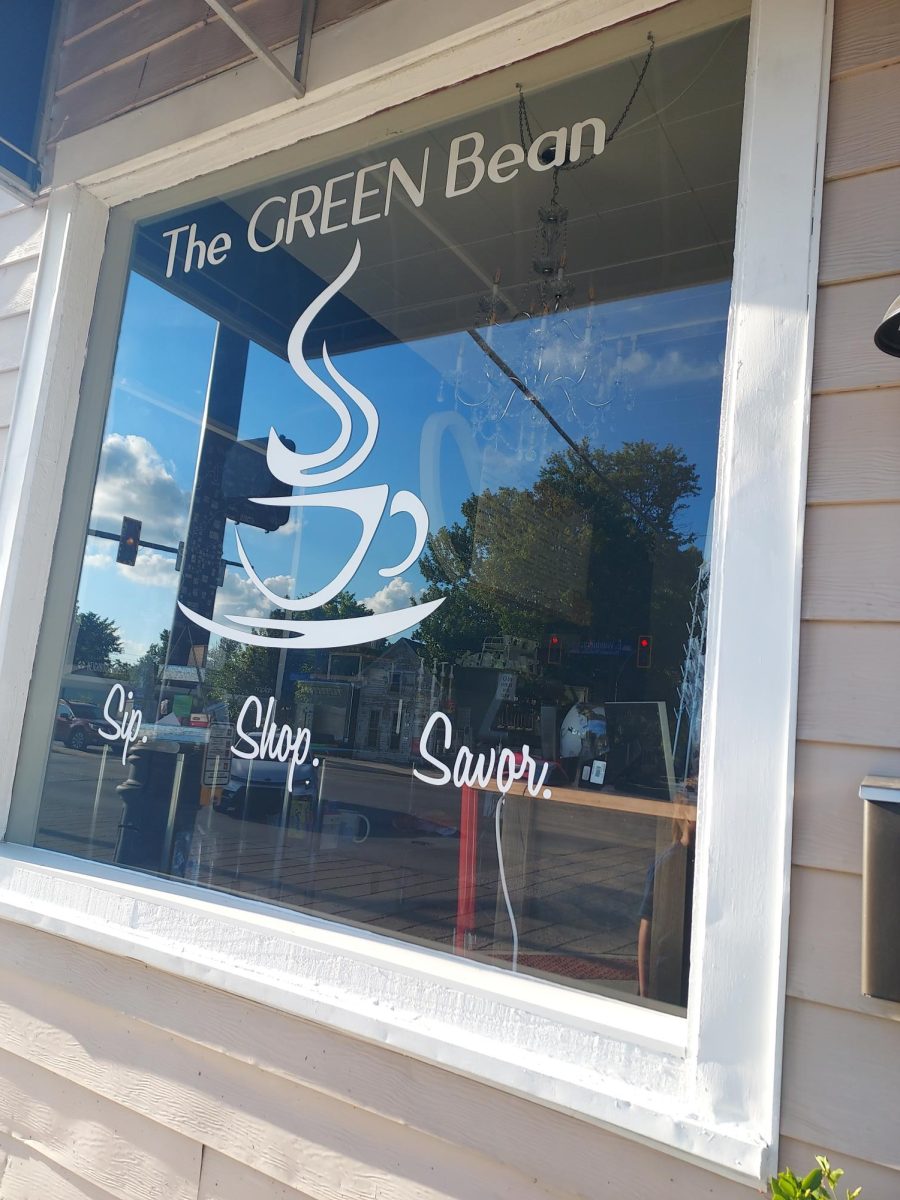 Right window of the front of the building. Another look at the excellent logo and slogan of the cafe.
