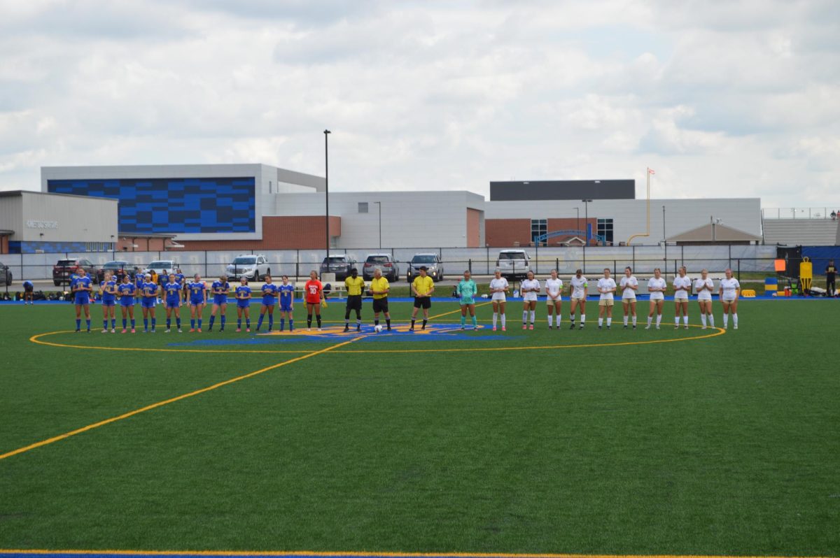 Girls´ varsity starters lineup for the National Anthem. 