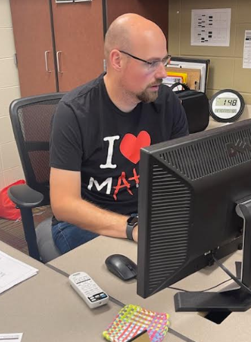 Algebra I and Geometry teacher Mr. Gordon works on creating assignments for his classes.