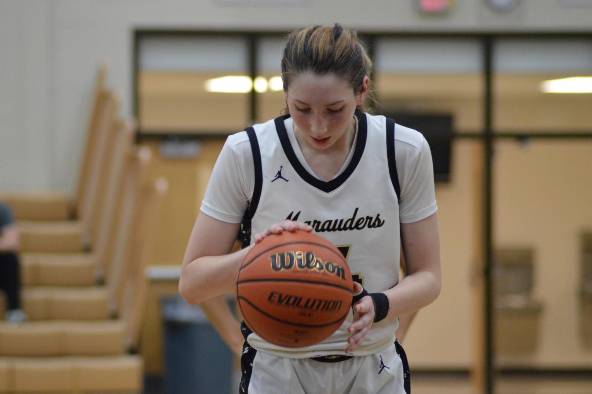 Number 12, Kanyonrae Kenny, preparing for a free throw.