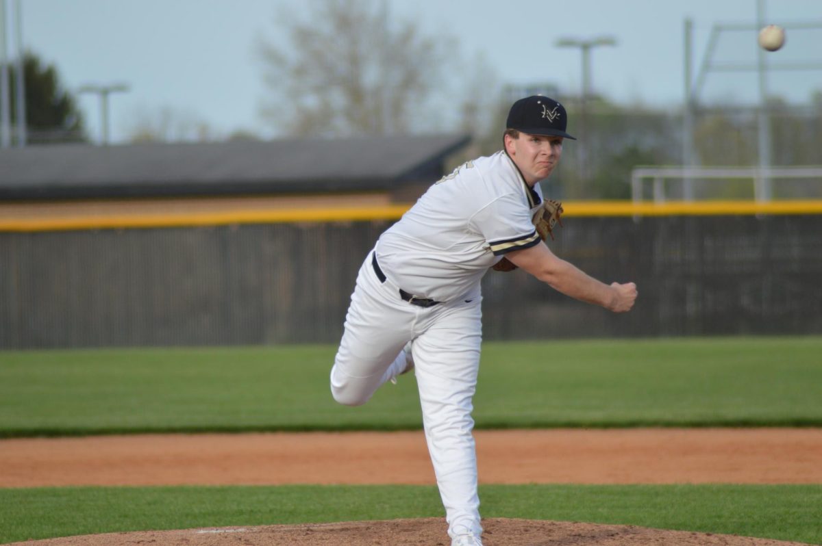 Number 15, Caden Taylor, 12, pitching 

