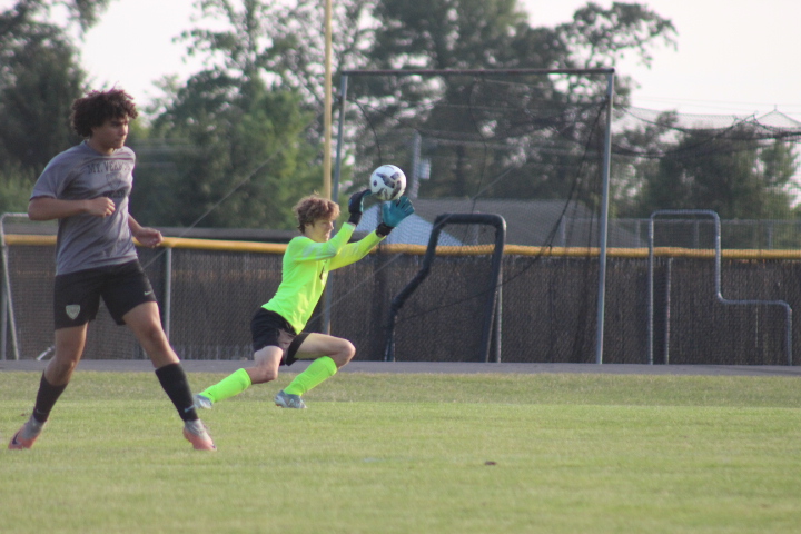 William Keppler (12) saves a shot from Warren Central.
