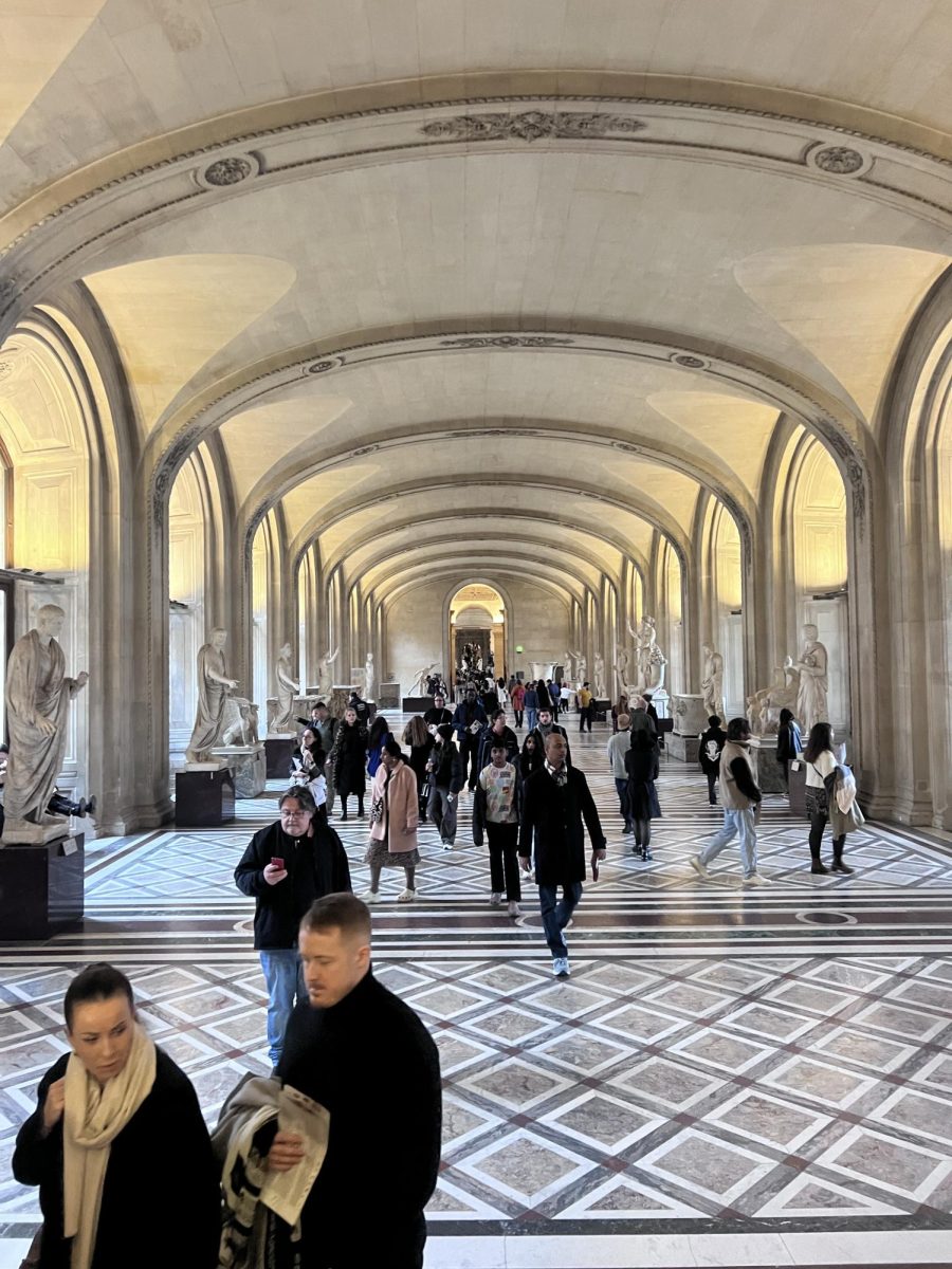 Louvre hallway with Greek sculptures.