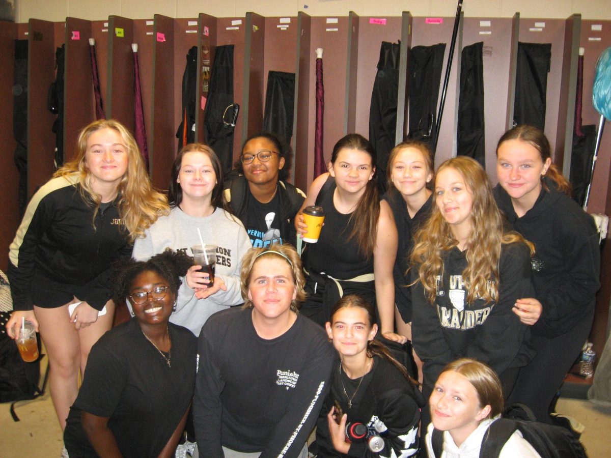 Most of the MV Color Guard team hangs out before morning practice.